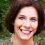Profile picture of Sarah L., a woman in her late 40s smiling confidently.